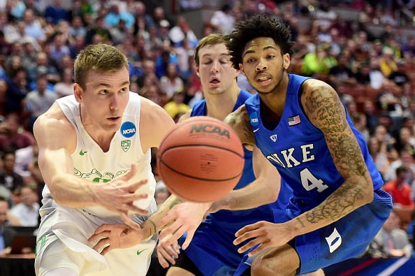 ANAHEIM, CA - MARCH 24:  Casey Benson #2 of the Oregon Ducks passes the ball against Brandon Ingram #14 of the Duke Blue Devils in the second half in the 2016 NCAA Men's Basketball Tournament West Regional at the Honda Center on March 24, 2016 in Anaheim, California.  (Photo by Harry How/Getty Images)